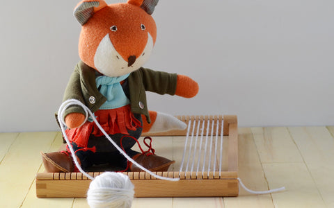 Owen Fox Wrapping Yarn into the Shuttle of the Loom