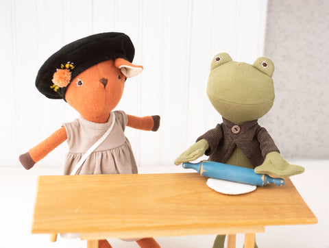 Lewis Toad rolling out clay with Phoebe Fawn