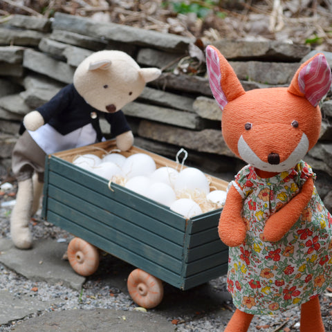 Nicholas and Flora gather eggs in the wagon