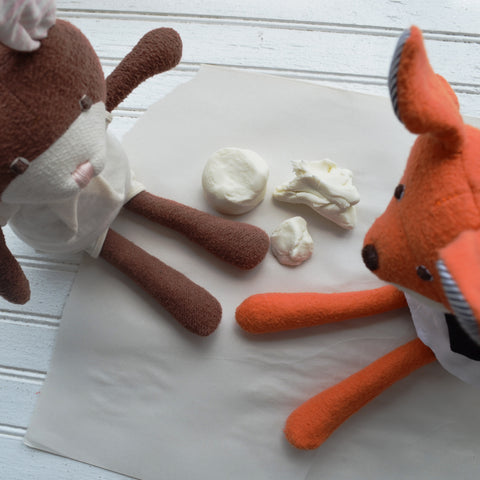 Owen Fox and Juliette Rabbit play with clay