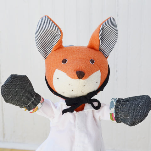 Reginald Fox wears gardening gloves