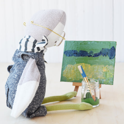 Jeremy Owl looking at his green painting