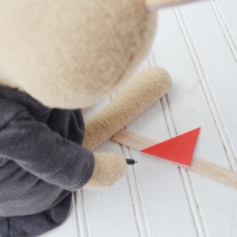 Juliette Rabbit cutting thin sticks for doll picture frames