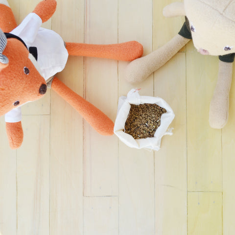 Reginald Fox and Annicke Mouse with bag of seeds