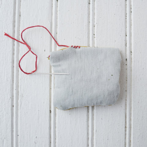 Sewing the herb pillow shut