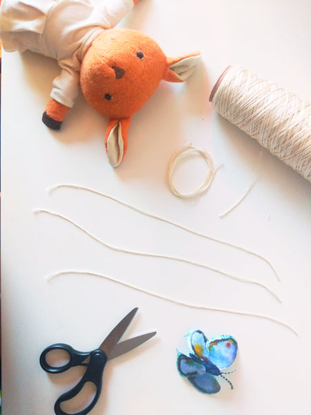 Phoebe Fawn and butterfly mobile